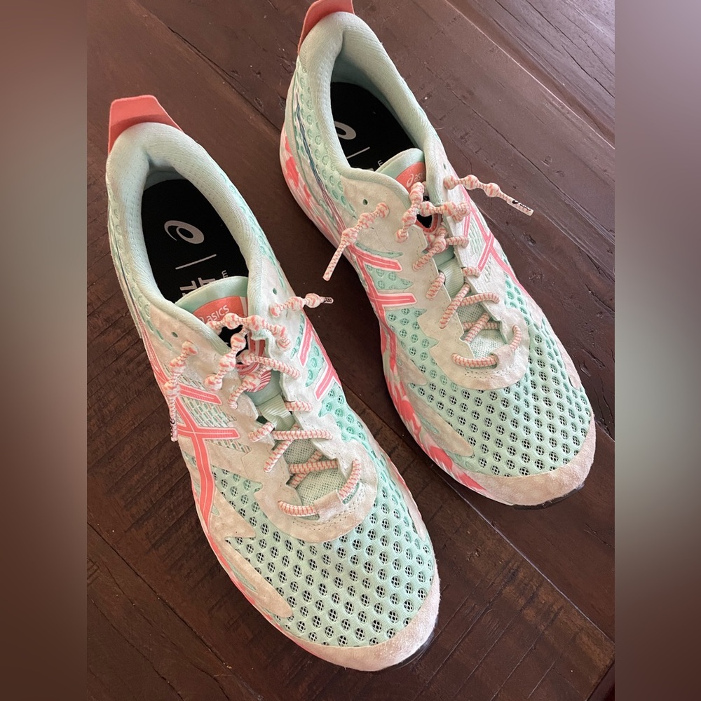 ASICS’s running shoes. NEW condition. Size 10 - 10.5. Aqua/peach trim.